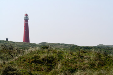 Fototapeta na wymiar Lighthouse the Noordertoren (red tower) isle of Schiermonnikoog