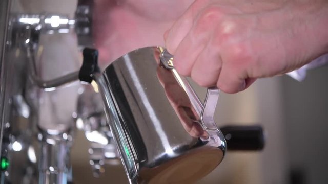 Italian Barista Steaming Milk For the Cafe Latte. Closeup Video