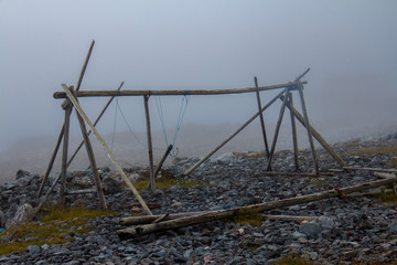 Fototapeta na wymiar Old empty fish stand in the fog