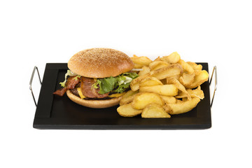 Hamburger with potatoes on a plate made at home