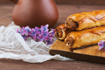 three tender cake with a spoon on a wooden background. Selective focus, close up