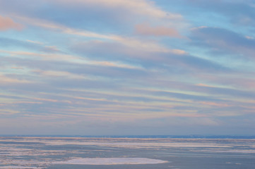 Fototapeta na wymiar Colorful winter skies on icy waters