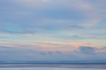 Colorful winter skies on icy waters