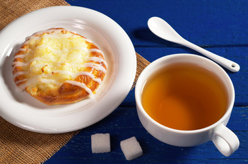 Tea and bun with cottage cheese