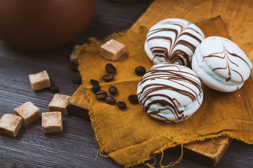 three white tender cake with a spoon on a vintage wooden background. Selective focus, close up