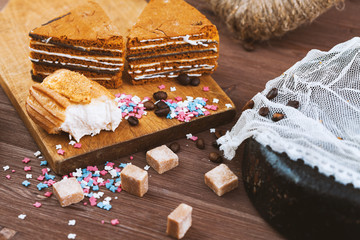 three tender cake with coffee beans and bright powder on a gray wooden background. Selective focus,...