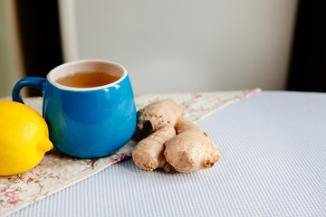 Cup of herbal tea with ginger and lemon, with copy space