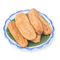 sun dried banana on plate isolated on white background