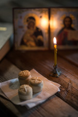 andle against the background of orthodox icons