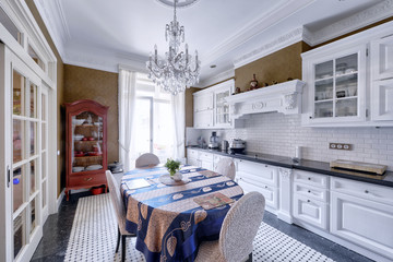 Modern design white kitchen in a spacious apartment.