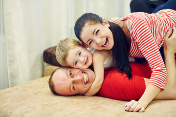 Fototapeta premium Parents with child at home