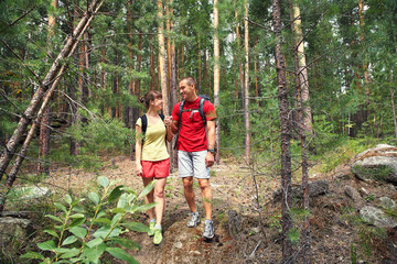 couple hikers in forest