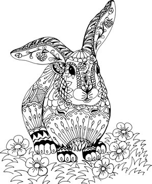 Rabbit among the flowers. Freehand sketch drawing for adult antistress coloring book