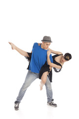 Two modern ballet dancers in dynamic action figure, on white background