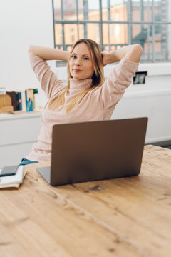 Relaxed thoughtful young businesswoman