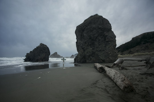 Lone surfer Pistol River, Myers Creek Beach,  Oregon
