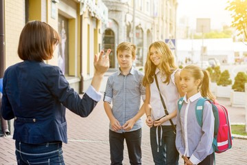 Outdoor portrait group of students with teacher.