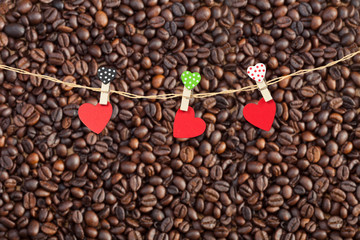Handmade three wood hearts hanging on cloth line or rope