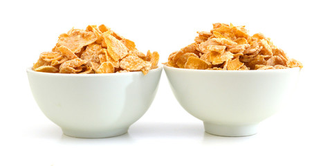 Closeup of delicious cereals in white bowl on a white background