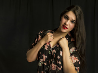 beautiful young woman in her 20's in a close-up portrait in studio