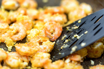 Close-up of shrimps fried in a frying pan