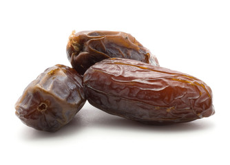 Three date fruits Medjool isolated on white background.