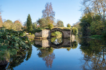 Fototapeta na wymiar Reflected bridge in water