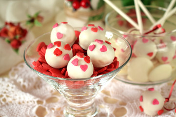 White chocolate sweets decorated with little confectionery hearts
