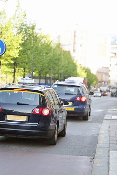 Taxis driving in street
