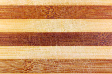 Texture of vintage wooden board with scuffs and scratches. Natural wood background
