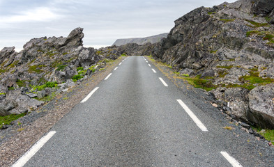 Rocky cliffs on the coast of the Barents Sea along the Varanger Tourist Route