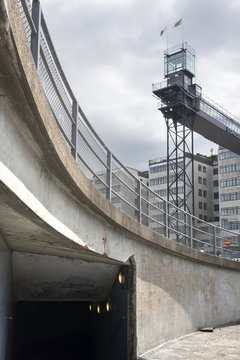 Tunnel in concrete structure and apartment blocks