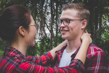 couple standing and holding each other. boyfriend & girlfriend dating in valentine's day. man & woman  hugging outdoor. relationship, lover lifestyle concept