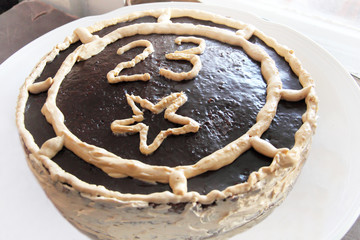 Cake decorated chocolate with number twenty three on plate on celebrate 23 february