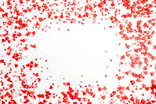 Valentine's Day background. Flat lay, top view frame of red, pink and white hearts. Love concept.