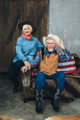 Obraz na płótnie Canvas elderly couple, cowboy style