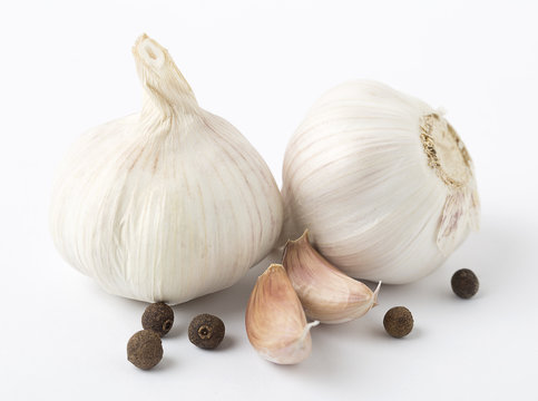 Fresh garlic with black pepper isolated on white background. Isolated garlic