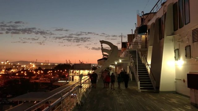 LONG BEACH, CA - AUGUST 2017: Historic Queen Mary deck at sunset. This 1936 ocean liner and battlecruiser is now a hotel and tourist attraction docked in Long Beach Harbor