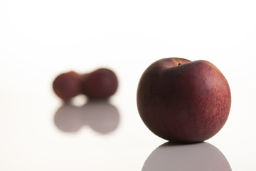 three peaches on white background