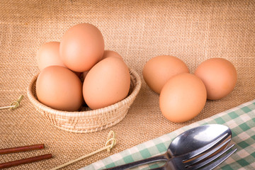 Set Eggs in a basket on  gunny (sackcloth)  background