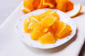 Orange sliced in white plate