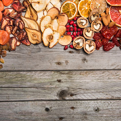 Different dried fruits on a wooden surface