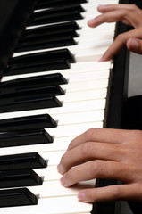 Obraz premium Child hands on piano keyboard