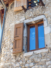 Traditional old classic buildings architecture, windows and doors, in countryside area of France
