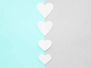 Hearts from paper cards. Blue and gray paper background. Valentine's day concept.