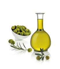 bottle of olive oil with a small bowl of green olives