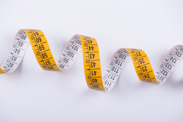 Measuring tape on white background. Isolated.
