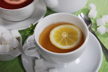  lemon tea with sweet cookies and sugar cubes