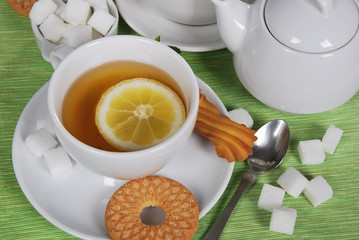  lemon tea with sweet cookies and sugar cubes