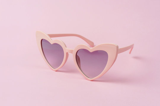 Pink heart shape sunglasses isolated